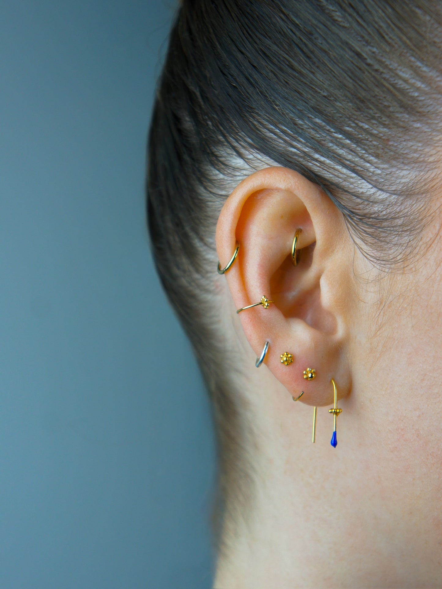 Felt Thr AA gold earring