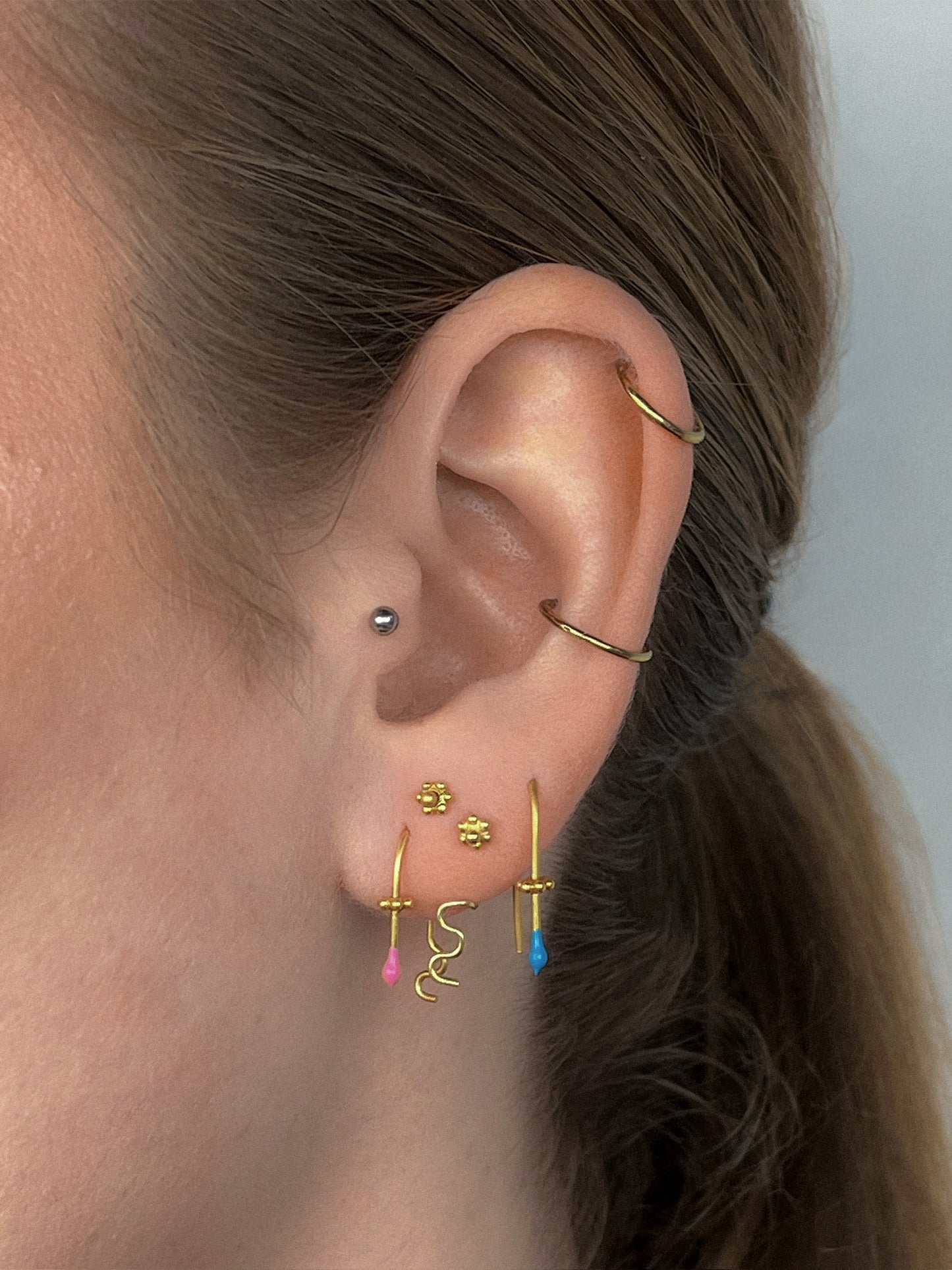 Felt One AA gold earring